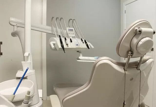 empty dentist chair and tools
