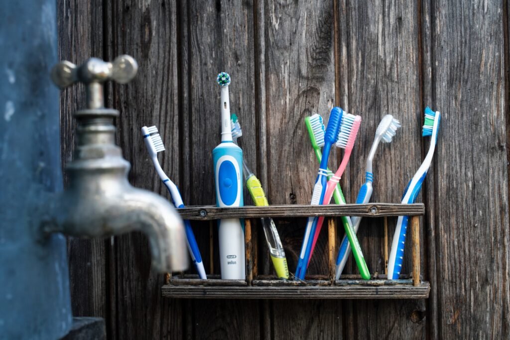 assorted toothbrushes in bathroom