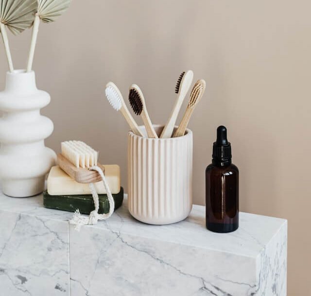 bamboo toothbrushes in cup