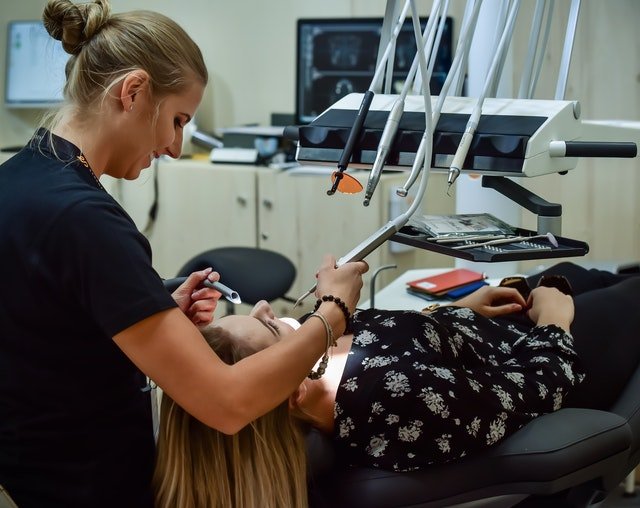 dentist and patient in exam